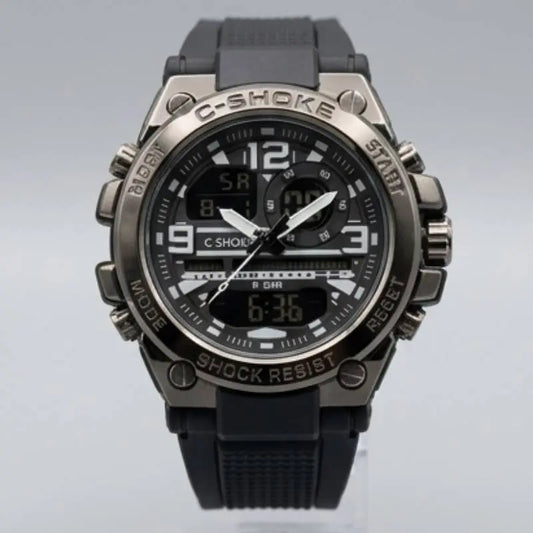 C-Shoke analog-digital sport watch with a black rubber strap, black dial, and a metallic gunmetal gray case with textured details.