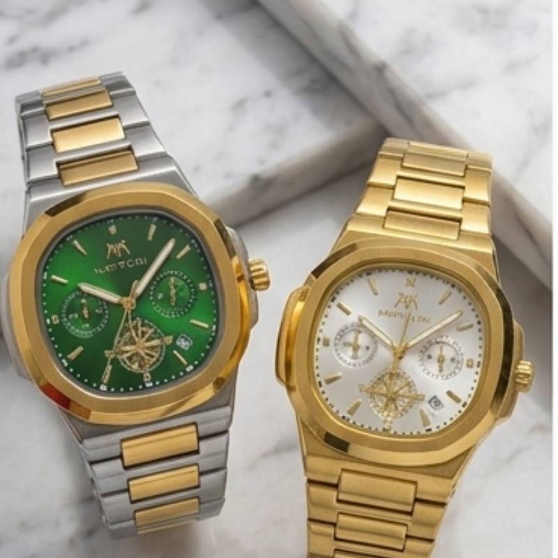 Two luxury wristwatches by Montblanc, displayed side-by-side on a white marble background. The watch on the left features a two-tone silver and gold stainless steel bracelet, a gold bezel, and a vibrant green dial.
