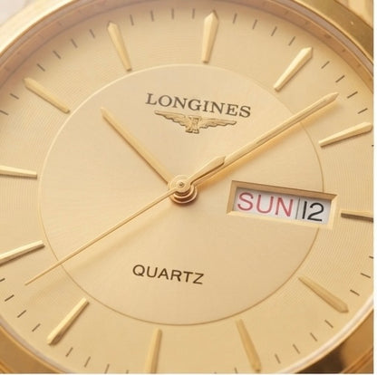 Close-up of a Longines Quartz watch dial in gold-tone metal, showing the brand name, wing logo, hour markers, hands, and a day/date window displaying SUN 12.